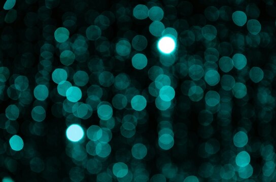 blue flashlight stars (blur) on a black background