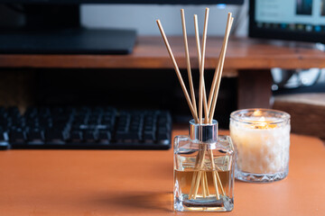 Stylish Glass Diffuser and Candle on Desk
