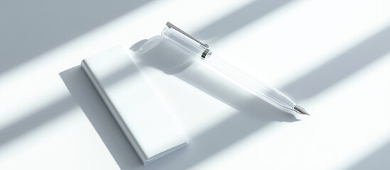 Elegant glass pen and stationery mockup set against a bright background, featuring soft shadows and ample space for personalized text.