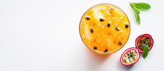 Fototapeta premium Passionfruit Drink in Glass with Mint Leaves on White Background Ideal for Beverage Promotion and Copy Space for Text