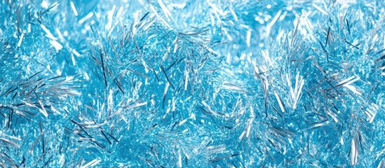 Shimmering light blue metallic tinsel texture background with ample empty space for text or design elements