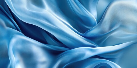 Obraz premium Elegant flowing light blue silk fabric texture with smooth waves and ample space for text overlay or design elements