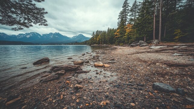 Tranquil nature landscape mountain lake shoreline scenic serene environment low angle view peaceful wilderness experience - Powered by Adobe