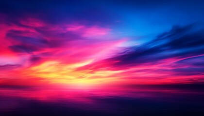 Fototapeta premium Vibrant sunset with colorful clouds over calm sea, creating a stunning and serene natural landscape view.