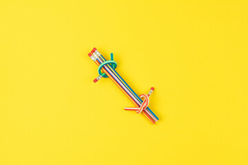 Pencils on yellow surface symbolize pursuit of each solution, solution emerging from pattern recognition, solution empowering fresh perspectives in creative problem solving