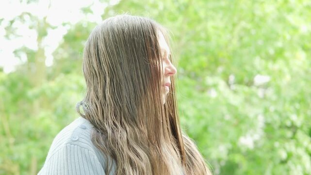 older woman with greasy, graying hair hanging in limp clumps, concept hair loss, health haircut care, hormonal imbalance