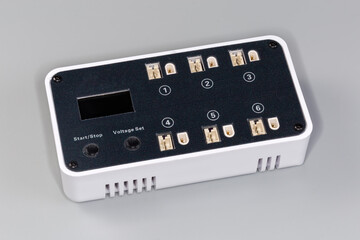 Battery charger for rechargeable LiPo batteries on a gray background