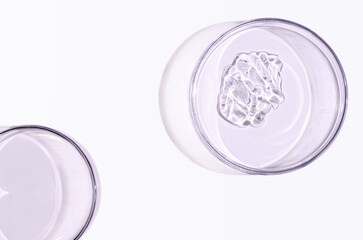 Skin serum or face wash gel in a Petri dish. For cosmetic procedures.