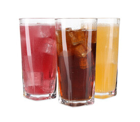 Soda water of different flavors with ice cubes in glasses isolated on white