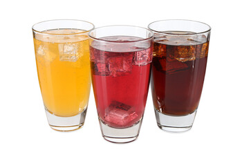 Soda water of different flavors with ice cubes in glasses isolated on white