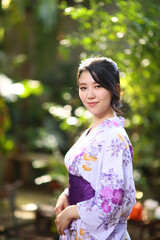 portrait woman with yukata dress in the garden
