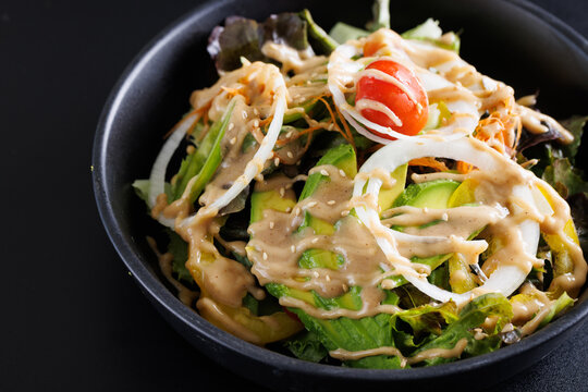 Japanese salad isolated in black background