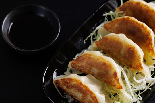 Gyoza Japanese food dumpling isolated in black background