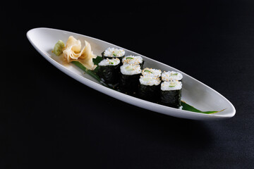Kappamaki Cucumber Sushi Roll Japanese food isolate in black background