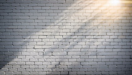a white brick wall with a sun shining on it