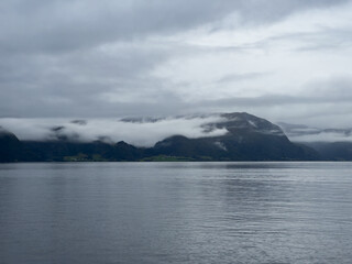 A scene of a ferry on a rainy day crossing the Sogn Fjord, Norway