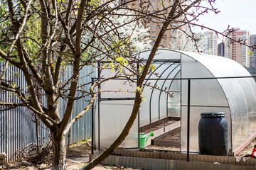A new greenhouse made of polyethylene and polycarbonate with new beds made of Wood-polymer...