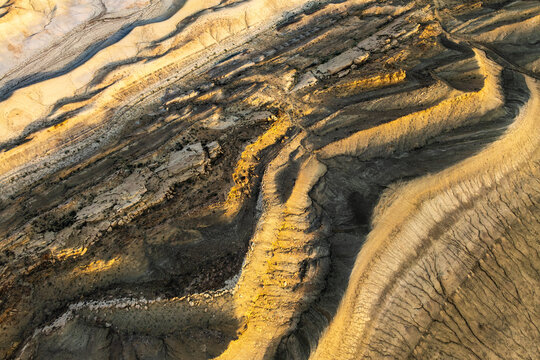 Aerial view of golden sandstone desert landscape in Utah