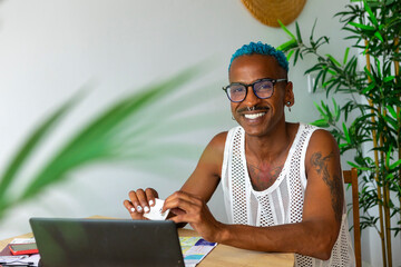 LGBTQIA+ individual enjoying holiday planning at home