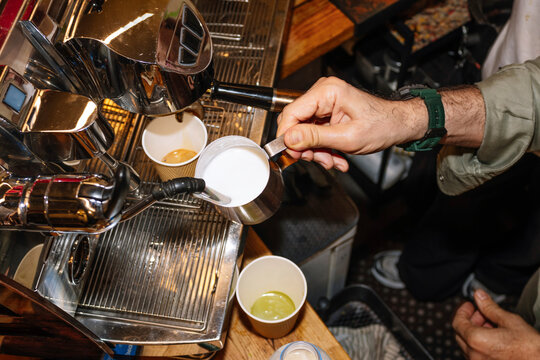 Barista crafting a specialty coffee with precision