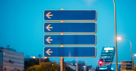 Downtown navigation with street sign pointing in multiple directions