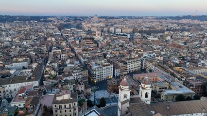 Obraz premium Rome at dawn. The historic center and Piazza di Spagna. Aerial panoramic photo of the rooftops of central Rome.