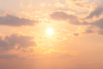 Beautiful Golden Sunset with Soft Clouds in a Tranquil Sky Capturing the Warmth and Serenity of a Peaceful Evening