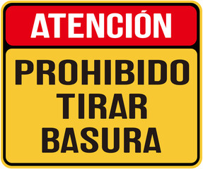 A sign in yellow color that says in spanish : Attention: littering is prohibited