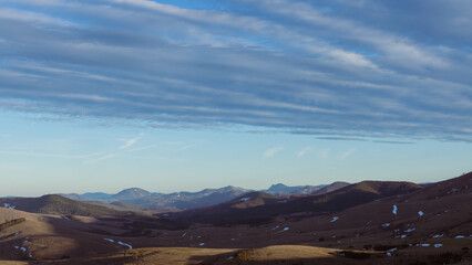 Majestic Mountain View with Layered Clouds