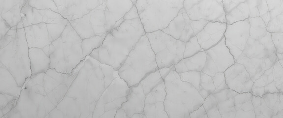 Smooth white marble surface with fine veins and cracks.