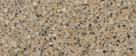 Close-up view of a textured surface with various stones and grains.