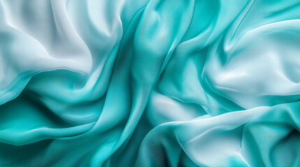 Obraz premium Textile fabric in shades of turquoise and white arranged in a flowing pattern