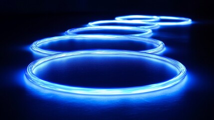 Glowing blue circles realistic set isolated on black background. Vector illustration of glowing neon rings with motion effect. Round trace of thunder energy swirling at high speed. Magic light