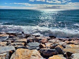 waves and rocks. On the beach of Almuñécar in Andalusia in the south of Spain.