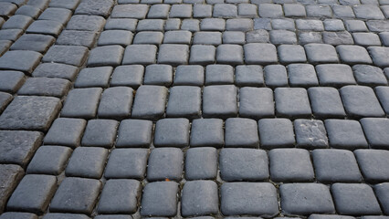 Cobblestone Street Texture Seen Within a Vibrant Urban Environment, Showcasing its Charm