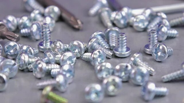 Metal screws for fastening equipment. Soft focus. Close-up. 