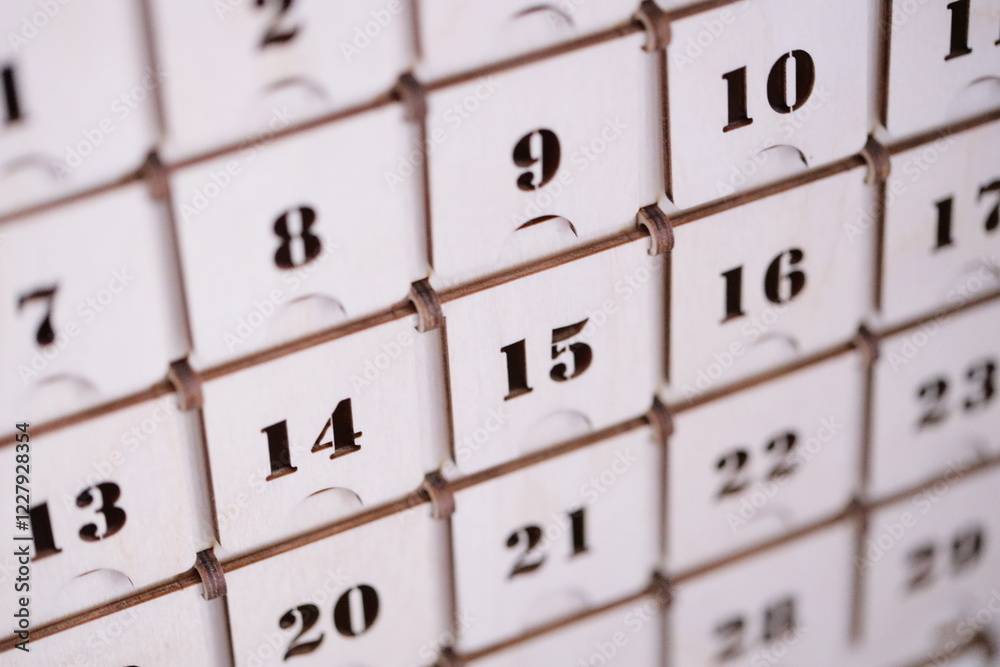 Aufkleber A close-up view of a calendar with numbers and dates displayed.