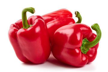 Red ripe bell peppers, isolated on white background.