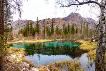 Geyser lake with turquoise water in Altai in autumn. Siberia, Russia.  November.