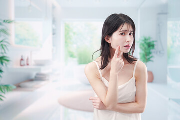 Naklejka premium 肌トラブルに悩む若い女性