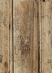 Fototapeta premium old carved wooden door with intricate traditional uzbek patterns, east asian texture background