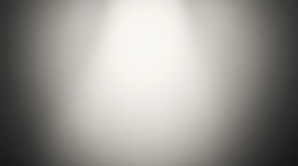 Vertical light beam on a gray gradient background.