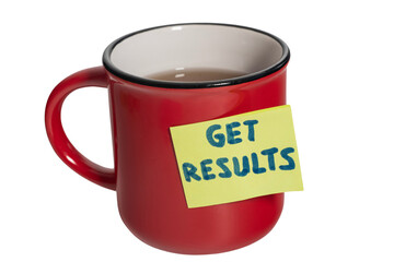 a red cup of tea with a sticky note saying: GET RESULTS