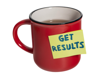 a red cup of tea with a sticky note saying: GET RESULTS