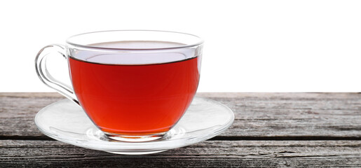 Refreshing black tea in cup on wooden table against white background