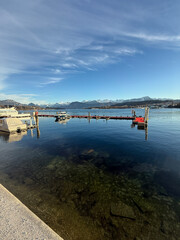 Lake Dock and Stalls. High quality photo A peaceful lake dock with stalls lined along the shore.