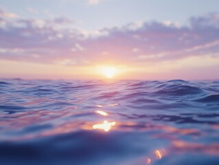 Obraz premium Golden sun setting over blue ocean waves.