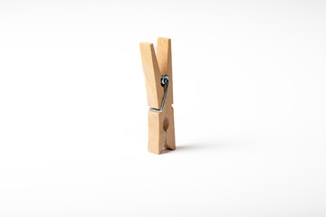 Wooden clothes peg isolated on white background
