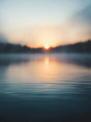 Fototapeta premium Blurry lake at sunrise with shimmering water