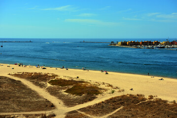 beach in ferragudo behind portimao algarve portugal